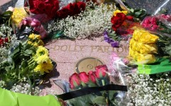 Flowers are seen on the Hollywood Walk of Fame Star of late US singer-songwriter Dolly Parton in the Hollywood neighborhood of Los Angeles on August 25, 2026.