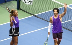 Serena Williams and Carlos Alcaraz salute the crowd after winning their mixed doubles opener at the US Open