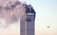 United Airlines Flight 175 is seen approaching the south tower of the World Trade Center as smoke billows from the north tower in New York on September 11, 2001