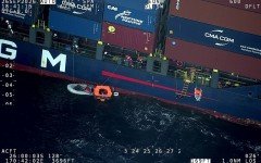 A 143-metre (470-foot) container ship rescued four sailors after their yacht collided with a sperm whale