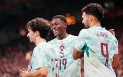 Portugal players celebrate after scoring one of their goals in a 4-2 victory away to Denmark