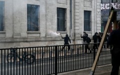 A protester holds a firework stick during protests in the soutwestern town of Bordeaux