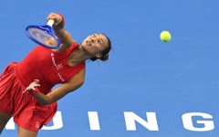 China’s Zheng Qinwen serves to Russia’s Mirra Andreeva