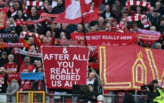 Liverpool fans hold signs mocking Manchester City's financial scandal