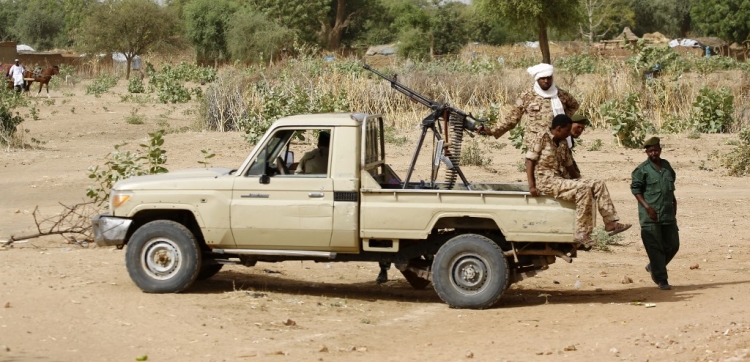 In this file photo taken on April 2, 2016, A convoy of Sudanese security forces deploy during a rally in al-Geneina, the capital of the West Darfur state.
