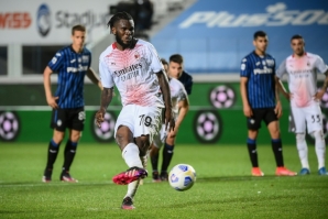 Ivorian Franck Kessie (C) converts a second penalty for AC Milan in a 2-0 win over Atalanta.
