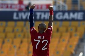 That's out: England's Tymal Mills celebrates after taking the wicket of Bangladesh's Mahedi Hasan