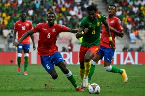 Cameroon midfielder Andre Franck Zambo Anguissa (2R) attacks against Gambia in an Africa Cup of Nations quarter-final in Douala on January 29.
