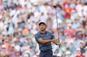 Tiger Woods watches his shot off the 10th tee with a huge crowd in the background in Thursday's opening round of the PGA Championship at Southern Hills