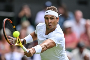 On top: Rafael Nadal returns the ball to Argentina's Francisco Cerundolo 