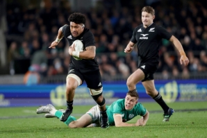Ardie Savea of New Zealand makes a break to score a try against Ireland