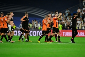 Shakhtar Donetsk players leave the pitch after a strong effort in their 2-1 defeat by Real Madrid.