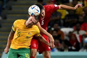 Australia's Mitchell Duke fights for the ball with Denmark defender Andreas Christensen