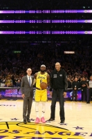 NBA Commissioner Adam Silver, LeBron James and Kareem Abdul-Jabbar stand on court after James became the NBA's all-time leading scorer on Tuesday