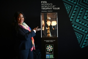 FIFA Secretary General Fatma Samoura poses next to the Women's World Cup trophy