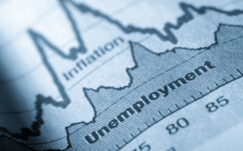 A folded sheet of paper with an unemployment graph on. Getty Images/JL Gutierrez