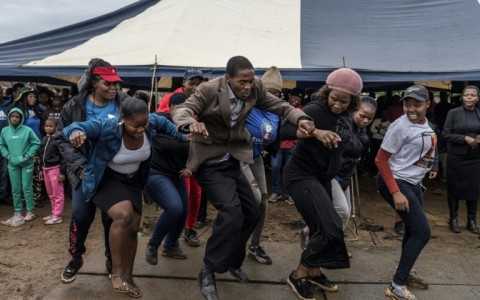 Supporters of an opposition candidate dance during a gathering in Siphofafeni on Wednesday