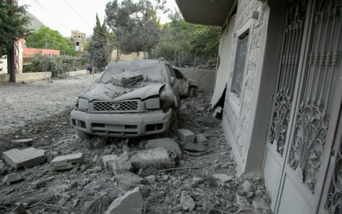 Rubble litters the area around a house hit by an Israeli air strike in the southern Lebanese village of Shebaa 