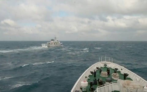 A Taiwan coastguard vessel (R) responds to a China Coast Guard ship (L) during Chinese military drills around Taiwan