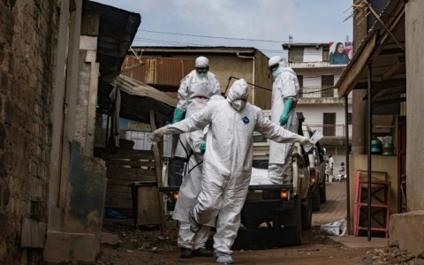 A Ugandan Red Cross worker during the evacuation of the body of a suspected Ebola victim in Kampala on May 26