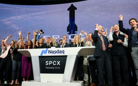 SpaceX employees celebrate the company's Wall Street debut, the largest initial public offering in US history
