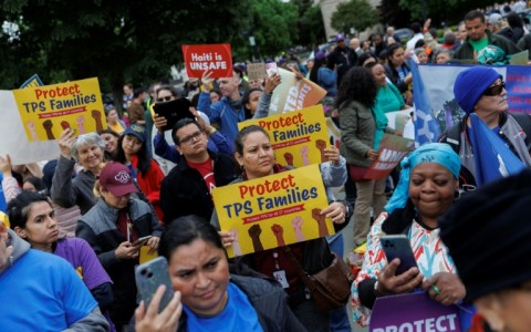 Demonstrators chanted and held signs outside the US Supreme Court as it weighed ending temporary protected status for Haitians and Syrians