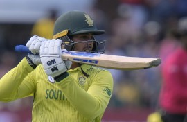 Quinton de Kock of South Africa looks on as he looses his wicket.