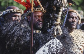 File: King Misuzulu kaZwelithini (C) gestures as he stands with Amabutho (Zulu regiments) during his coronation at the KwaKhangelamankengane Royal Palace in Kwa-Nongoma. north of Durban on August 20, 2022. Phill Magakoe / AFP