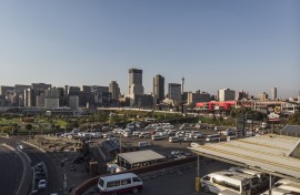 This aerial view shows the Johannesburg skyline and the Bree taxi rank in Newtown, Johannesburg, on May 7, 2020.