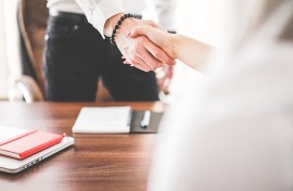 Business Man and Woman Handshake in Work Office