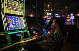 A woman gambles at the Montecasino complex after government allowed casinos, cinemas and restaurants to resume their activity.