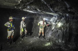 Miners busy with operations during their shift. AFP/Mujahid Safodien