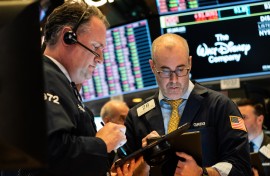 The greenback held gains against most currencies after a blowout in swap spreads showed investors are facing a shortage of dollars as equity markets plunged on fears about the economic impact of the flu-like virus.