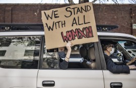 File: A woman holds a placard at a demonstration against gender-based violence in Johannesburg. AFP/Marco Longari