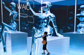 A child visits the World Artificial Intelligence Conference (WAIC) in Shanghai. AFP/Wang Zhao