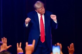Former US president and 2024 Republican presidential hopeful Donald Trump, pictured dancing at a campaign event, is facing multiple felony charges