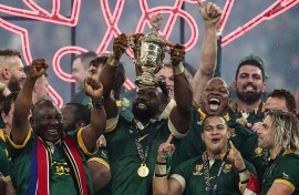 Springbok captain Siya Kolisi lifts the Webb Ellis Cup flanked by President Cyril Ramaphosa, Cheslin Kolbe and Faf de Klerk. AFP/Franck Fife