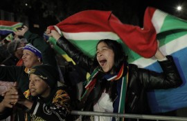South African rugby supporters celebrate at the Bree Street fan park in Cape Town. AFP/Gianluigi Guercia