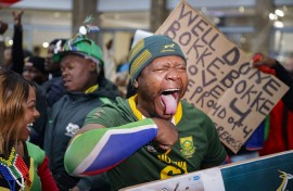 A supporter reacts ahead of the South African rugby team's arrival at the OR Tambo International airport in Ekurhuleni on October 31, 2023, after they won the France 2023 Rugby World Cup final match against New Zealand.