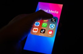 File: Social media apps on a smartphone screen. Jonathan Raa/NurPhoto via AFP