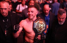 Dricus Du Plessis of South Africa celebrates with the middleweight title belt. AFP/Vaughn Ridley/Getty Images