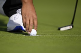 File: A golfer retrieves his ball. Orlando Ramirez/Getty Images via AFP