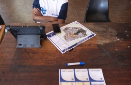 An IEC official waits for voters to be registered at a voting station. AFP/Emmanuel Croset
