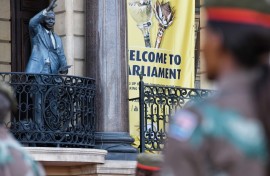 A SANDF member looking at Cape Town City Hall ahead of SONA 2024. GCIS