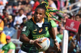 File: Rosko Specman of South Africa runs with the ball. AFP/Karim Sahib