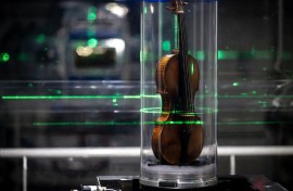 The world's most famous violin, "Il Cannone", made in 1743 and played by the great virtuoso Niccolo Paganini, being examined. AFP/Jean-Philippe Ksiazek