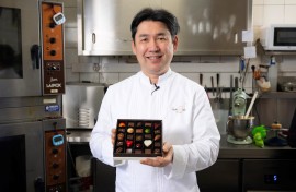 apanese chocolatier Yasushi Sasaki holds a box of chocolates. AFP/John Thys