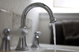 File: In this photo illustration, water flows from a tap.