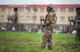 File: A SANDF soldier patrols a street in Hanover Park. AFP/Rodger Bosch