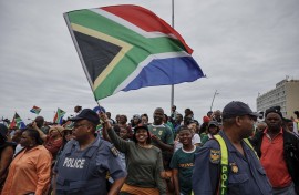 File: A woman waving the South African flag. AFP/Wikus de Wet